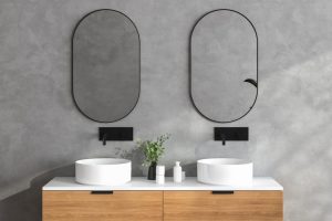 Two round wall-mounted bathroom mirrors