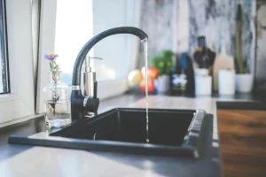 Black sink with running water