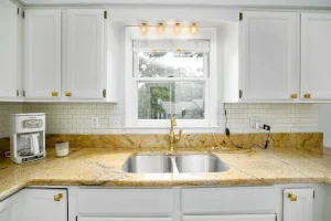A beautiful kitchen sink on a white kitchen